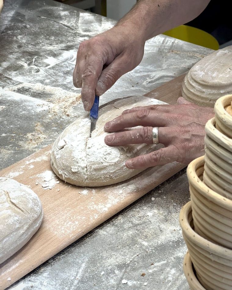 Scoring, by hand — The Globe Bakery, Laugharne