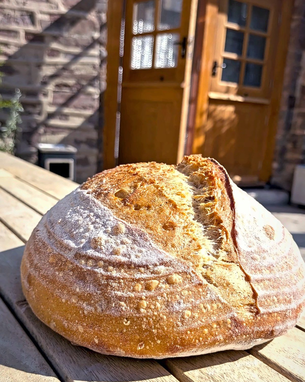 A fresh loaf at the bakery door, The Globe Bakery