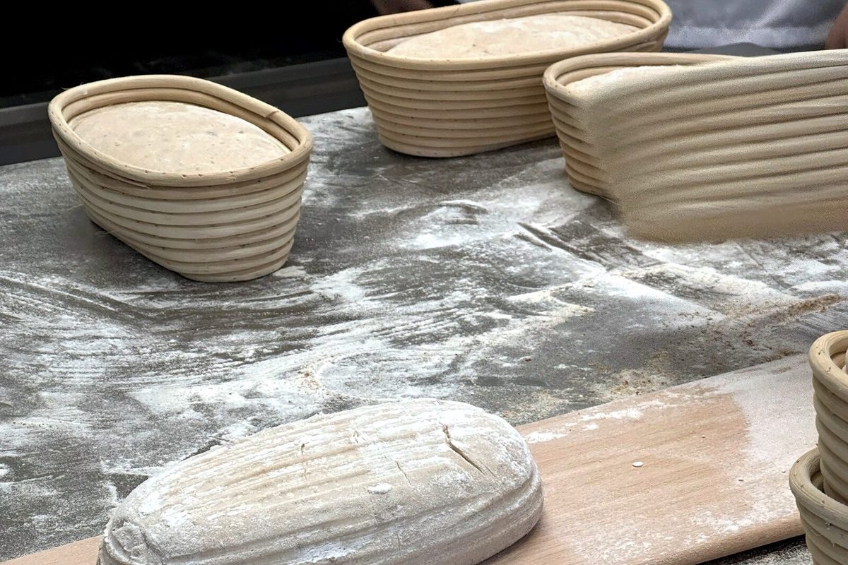 Shaping dough in the Globe bakehouse, Laugharne